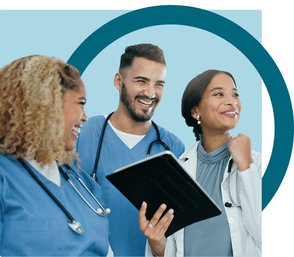 Three medical professionals stand together smiling